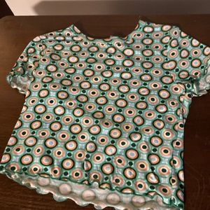 Green yellow white and black shirt